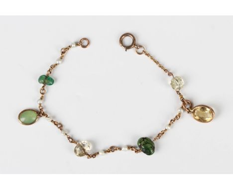 A gold, seed pearl and gem set bracelet, early 20th century, possibly Indian, mounted with a variety of gemstones, including 