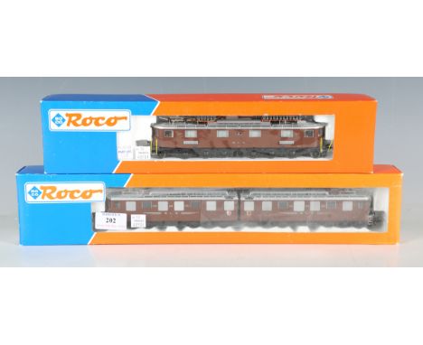 Two Roco gauge HO pantograph locomotives in BLS brown livery, comprising No. 63880 AE 8/8 274 and No. 43710 Ae 6/8, both boxe