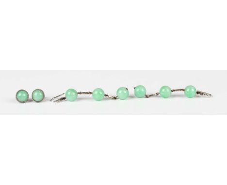 A pair of jade pendant earrings, each mounted with three beads, with wire fittings, length 5.5cm, a pair of jade single stone