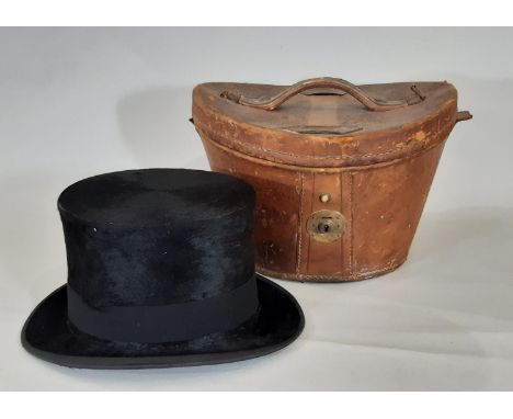 Vintage black silk top hat by Christys' in leather hat box lined with red velvet. Internal measurements 20x16cm, crown height