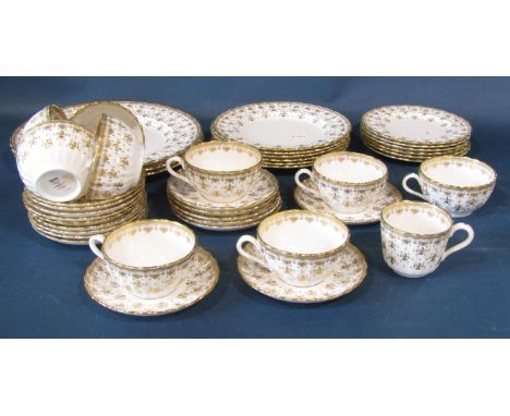 A Spode Fleur De Lys tea service in a white a gilt colourway comprising graduated plates, cups, saucers, etc 