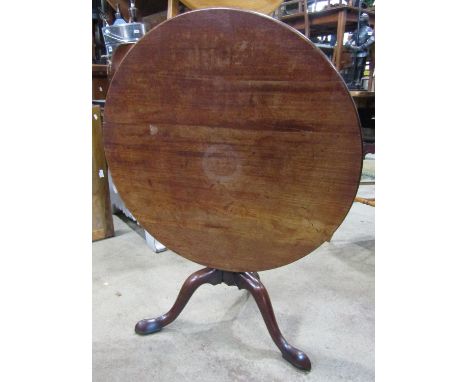 A Georgian mahogany snap top table on a reduced pillar and tripod 76 cm diameter 