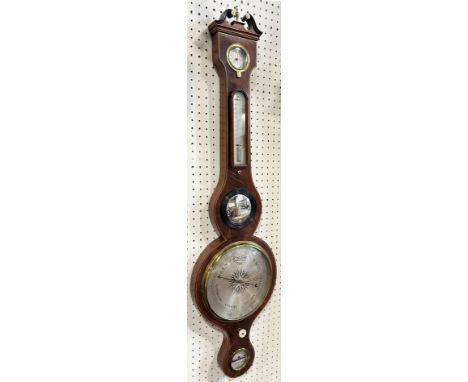 A Georgian mahogany wheel barometer with box wood and string inlay borders, silvered dials and swan necked pediment by AA. Or