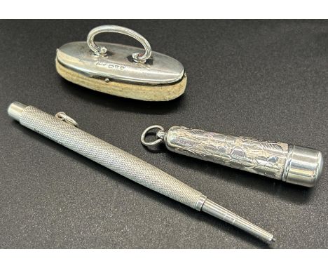 A silver vintage punch pencil, Birmingham 1939, together with a silver needle case with floral design, Birmingham 1919 and a 