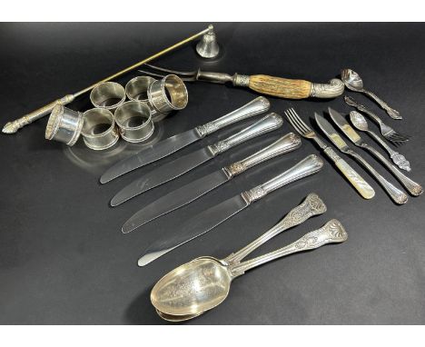 A small selection of silver plated table ware, six napkin rings, serving spoons, an antler handled carving fork, sundry knive