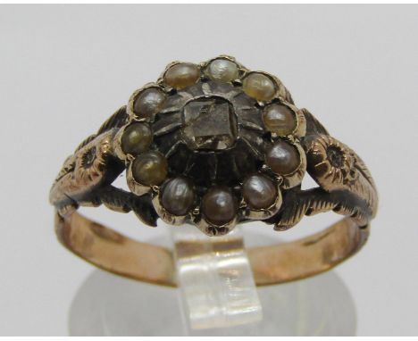 19th century yellow metal cluster ring set with a square diamond within seed pearl surround, size R, 3.1g 