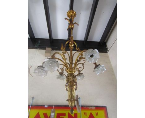 A continental gilt metal six light ceiling electrolier with bacchanalian mounts, 140 cm high x 50 cm wide approximately 