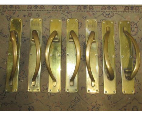 A set of seven good quality large heavy gauge vintage brass door handles with solid back plates, 65cm long 