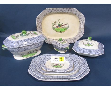 A Copeland Spode dinner service in the Exotic Pheasant pattern, with printed and infilled detail set within a blue starburst 