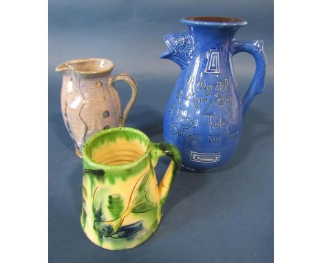 Barumware fish jug in a blue colourway with incised script, the spout in the form of a fishes head, a further Barumware mug w