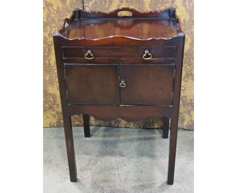A Georgian style mahogany tray top commode the front elevation enclosed by shallow drawer and a cupboard on square cut suppor