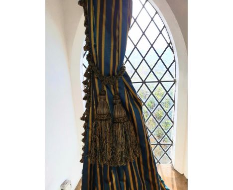One pair curtains in regency stripe (teal, gold and navy) with tassel detail, lined with pencil pleat headings and tie backs.
