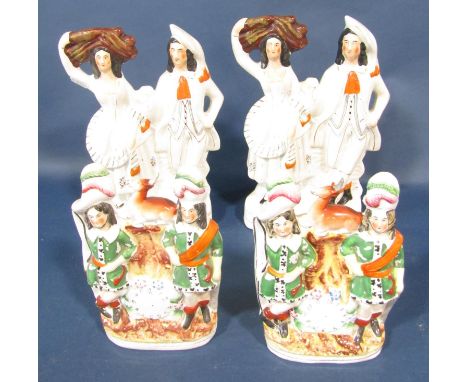 Four 19th century Staffordshire flatback figures comprising two Robin Hood clock figures and two harvesters 