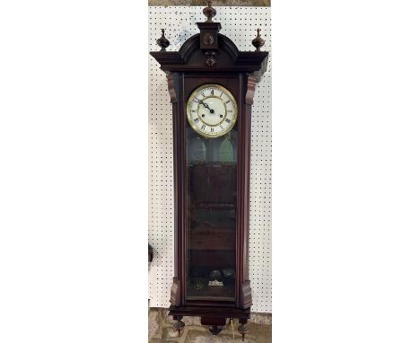 A Vienna style regulator wall clock with enamelled dial, with twin brass weight driven movement, the casework with applied mo