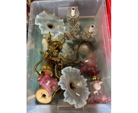 An Edwardian brass twin lamp parlour pulley ceiling light, three converted gas lamps worth cranberry crimped shades, a gilded