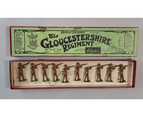 Britains set 119, Gloucestershire Regiment firing, in original Whisstock box with tie-in insert, unstrung. One head missing. 