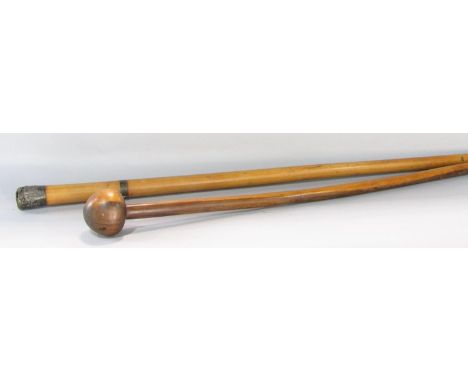 A Malacca walking cane with a split Chinese white metal top and collar, 85cm long, together with a naturally form hardwood ro