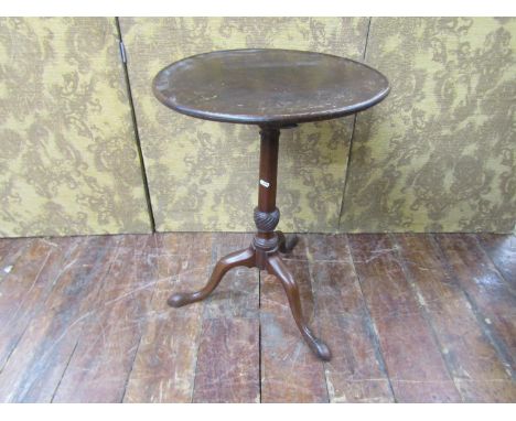 A 19th century mahogany circular snap top occasional table with turned pillar and shaped tripod 