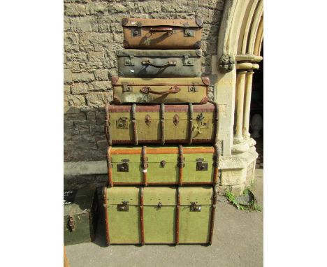 A stack of vintage luggage including timber banded examples an old green painted box and a timber crate (collection)
