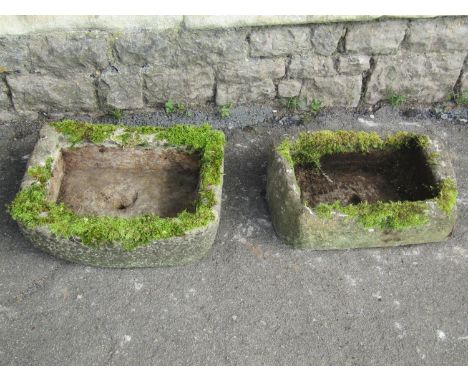 A nicely weathered composition stone rectangular bow fronted trough 50 cm x 38 cm x 16 cm high together with a further rectan