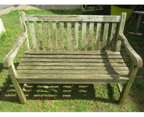 A Swan Hattersley weathered teak two seat garden bench with slatted seat and back, 120cm wide (af) 