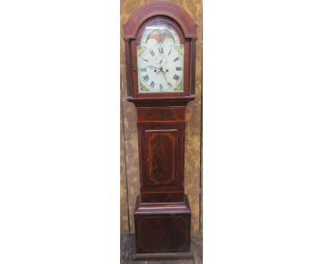 A regency mahogany longcase clock, the case with string banded inlay, the arched hood with column supports enclosing subsidia