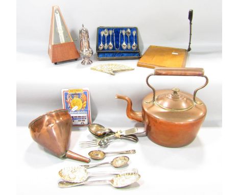 A mixed lot of items to include a German made metronome, a paper guillotine, a variety of silver plated flatware including tw