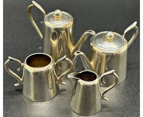 A miniature silver tea service to include teapot, coffee pot, milk jug and sugar bowl, Sheffield 1903, maker J &amp; J Maxfie