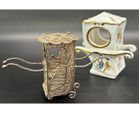 A silver miniature wirework filigree sedan chair in floral pattern weavings, together with a Hammersley miniature ceramic sed