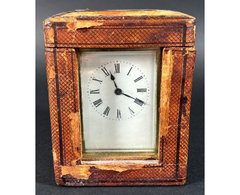 A late 19th century French carriage clock with eight day time piece set within original red Moroccan travelling case with key