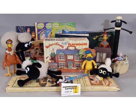 A boxful of Wallace &amp; Gromit merchandise and toys including 2 BBC Storyboard collection books,  a 'walking' Shaun the She