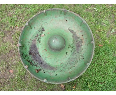 A vintage painted and weathered Mexican hat style cast iron pig feeding trough, stamped Bratley &amp; Son, Spalding, 90cm dia