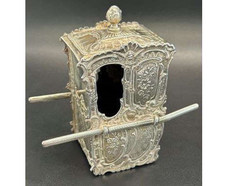 A silver Sedan chair deigned with floral garlands, London, 1902, maker Elly Isaac Miller, weight 3 oz approx 