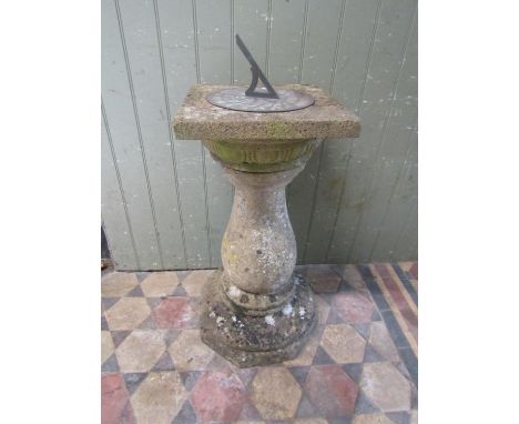 A weathered cast composition stone three sectional sundial with baluster column 90cm high 