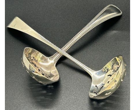 A silver sugar sifter decorated with a floral design, London 1796, maker Thomas Wallis II, weight 1.4oz, together with a simi