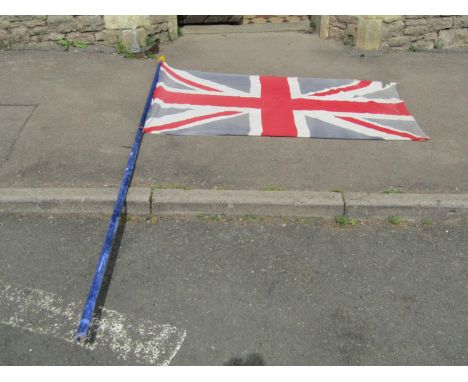 A union jack flag and painted wooden pole with pointed finial (9.5 feet approximately) 