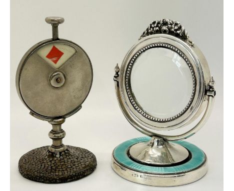 A small silver dressing table mirror with turquoises enamel base and floral detail to frame, together with a silver plated tr