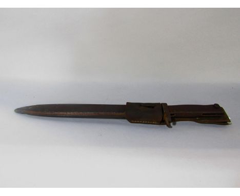 A German WWI Ersatz type bayonet with metal scabbard and leather belt loop, overall length 44cm 