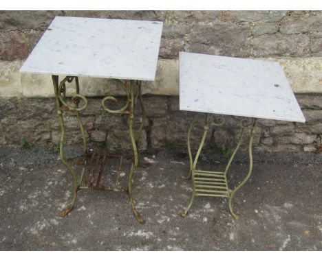 A small weathered light green painted metal garden/conservatory table with open scroll and swept supports beneath a square ov