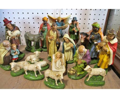 A vintage painted chalk ware Christmas Nativity set (camels neck glued) along with a stable, with original box and shredded p