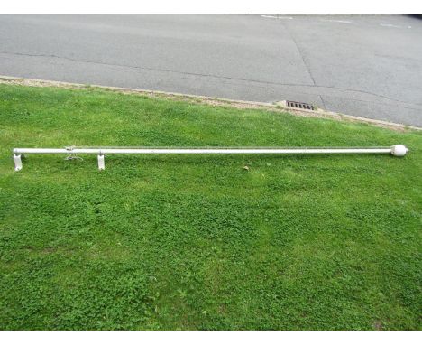 A vintage painted flag pole with tubular metal stem and turned wooden finial, and union jack flag 408cm high (13ft 4.5 inches