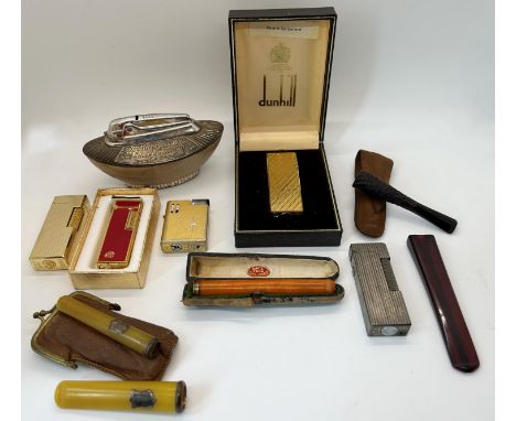 Smoking related items - Gold plated Dunhill lighter with engine turned detail, further Dunhill lighter with silvered finish, 