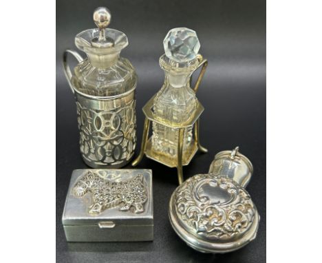 Three silver mini scent bottles two in stylish stands, one in a portable floral case, together with a sterling silver pill bo