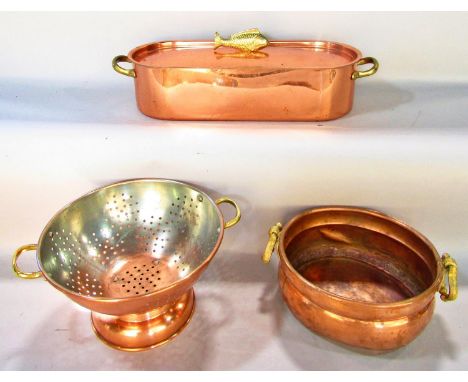 A vintage circular planter and a vintage drainer, together with a new copper fish poaching kettle. 