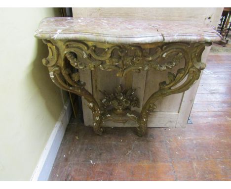 A 19th century console table, the framework with carved and pierced foliate detail, set beneath a marble top, the framework 9