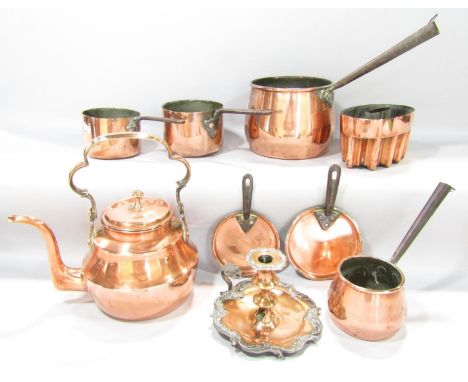 Vintage copper kitchen ware to include a jelly mould, a pair of saucepans with fitted lids, two further pans, chamber candles