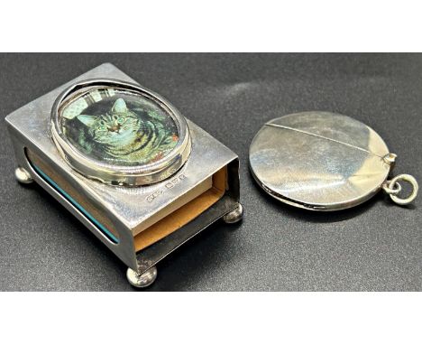 A silver vesta case, Chester 1904, maker Cohan &amp; Charles, together with a silver match box, Chester 1911, maker Grey &amp