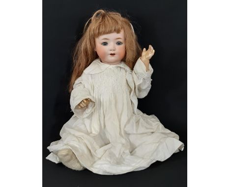 Early 20th century bisque head character doll by Ernst Heubach with blue closing eyes, open mouth with teeth and 5 piece bent