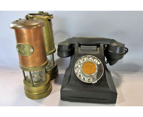 A brass miners lamp made by Hockley Lamp &amp; Limelight Co, together with another copper and brass example simply stamped Sc
