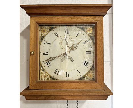 A Georgian cottage wall clock with square painted dial and thirty hour striking movement with subsidiary calendar and seconda